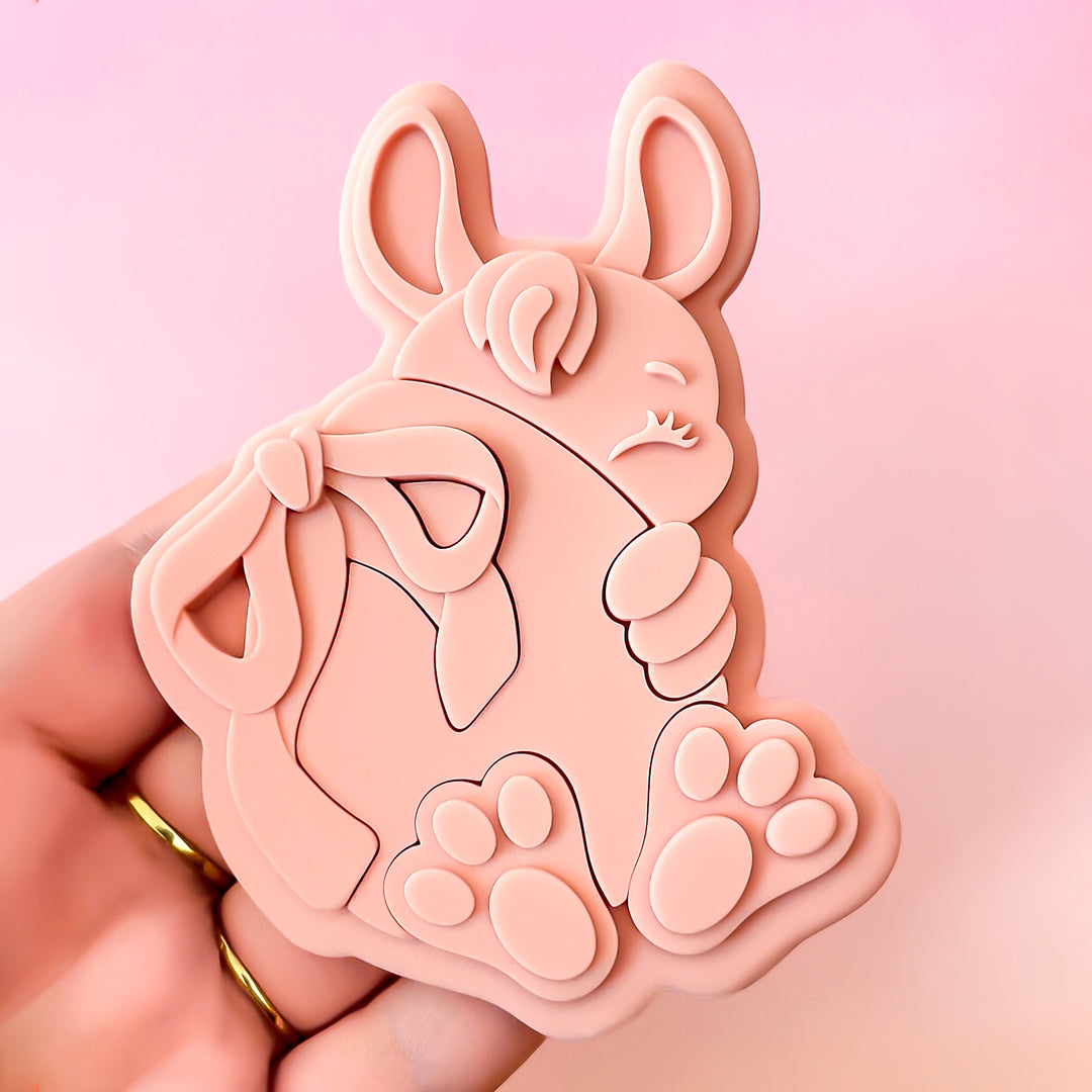 Bunny Holding Egg With A Bow